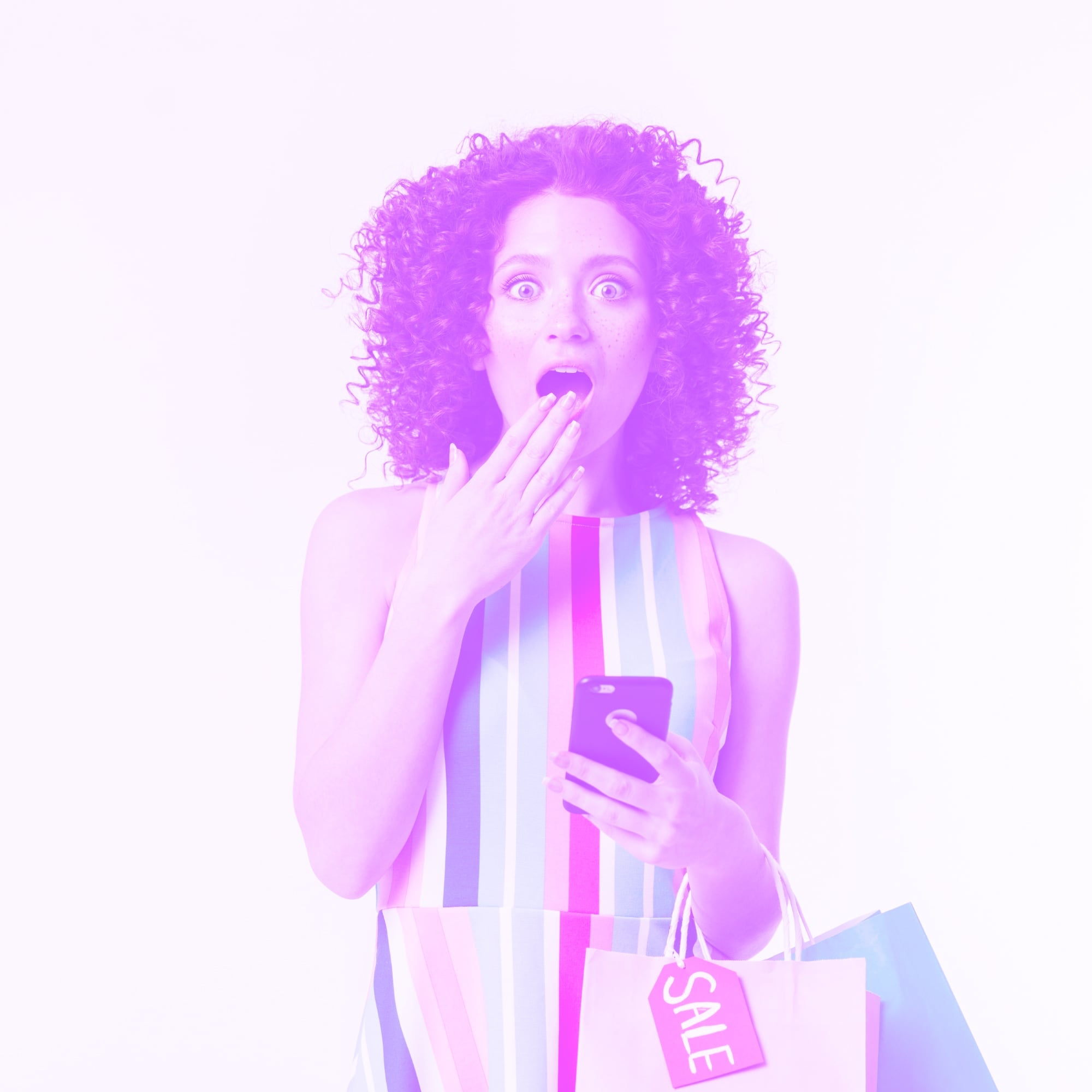 excited woman holding phone and shopping bags with sale tag purple toned