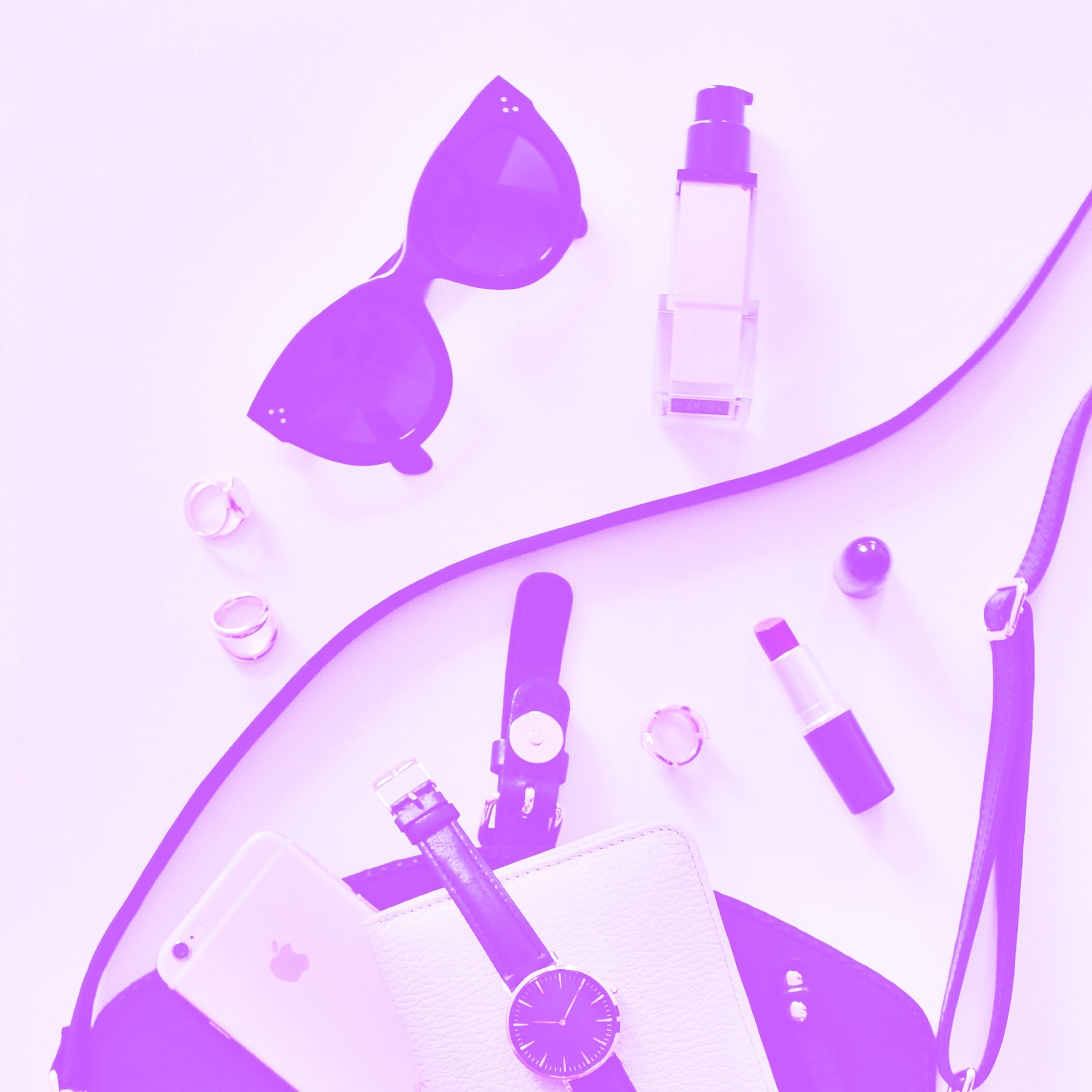 woman smiling holding phone with shopping app on screen purple toned