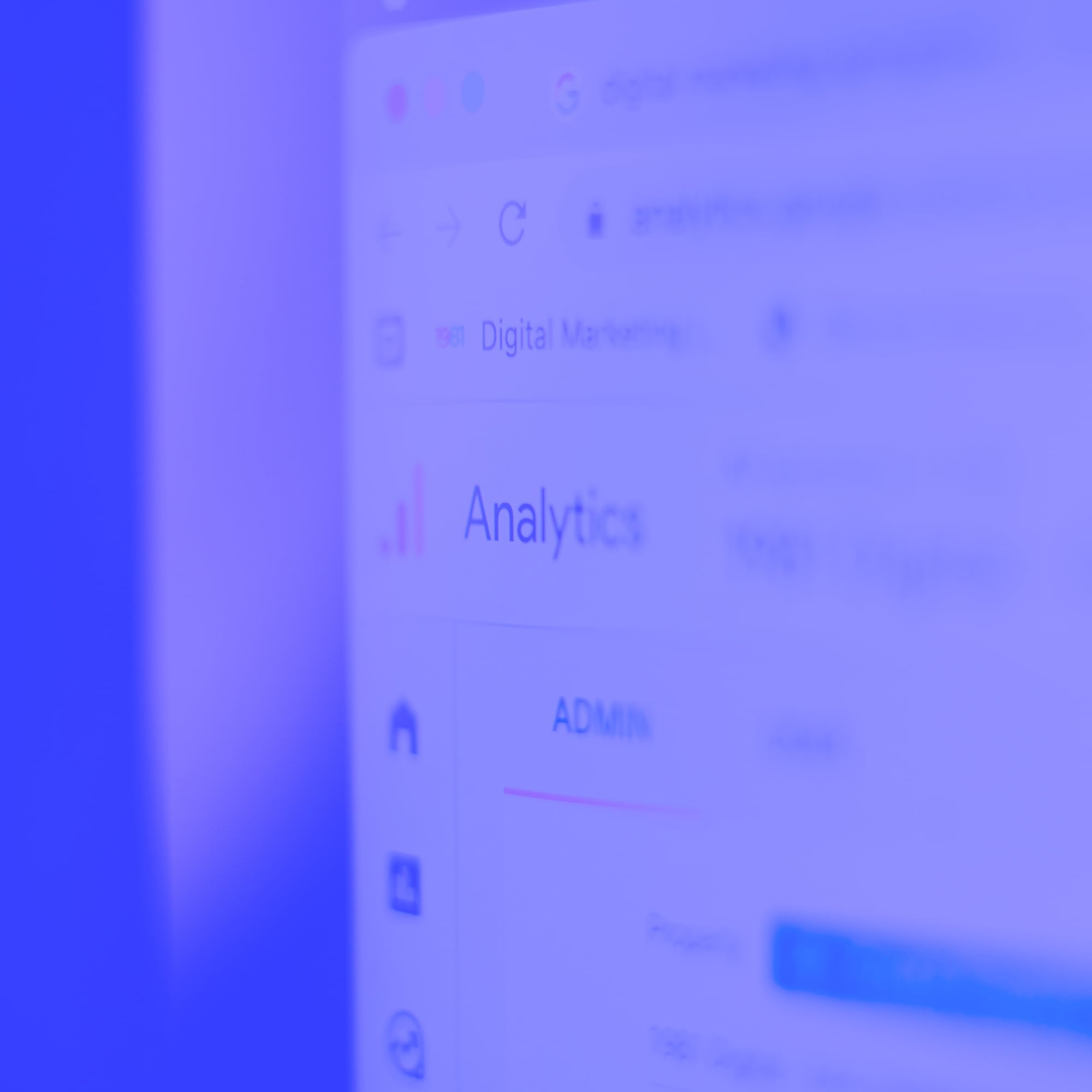 google analytics admin dashboard on monitor screen showing digital marketing data blue
