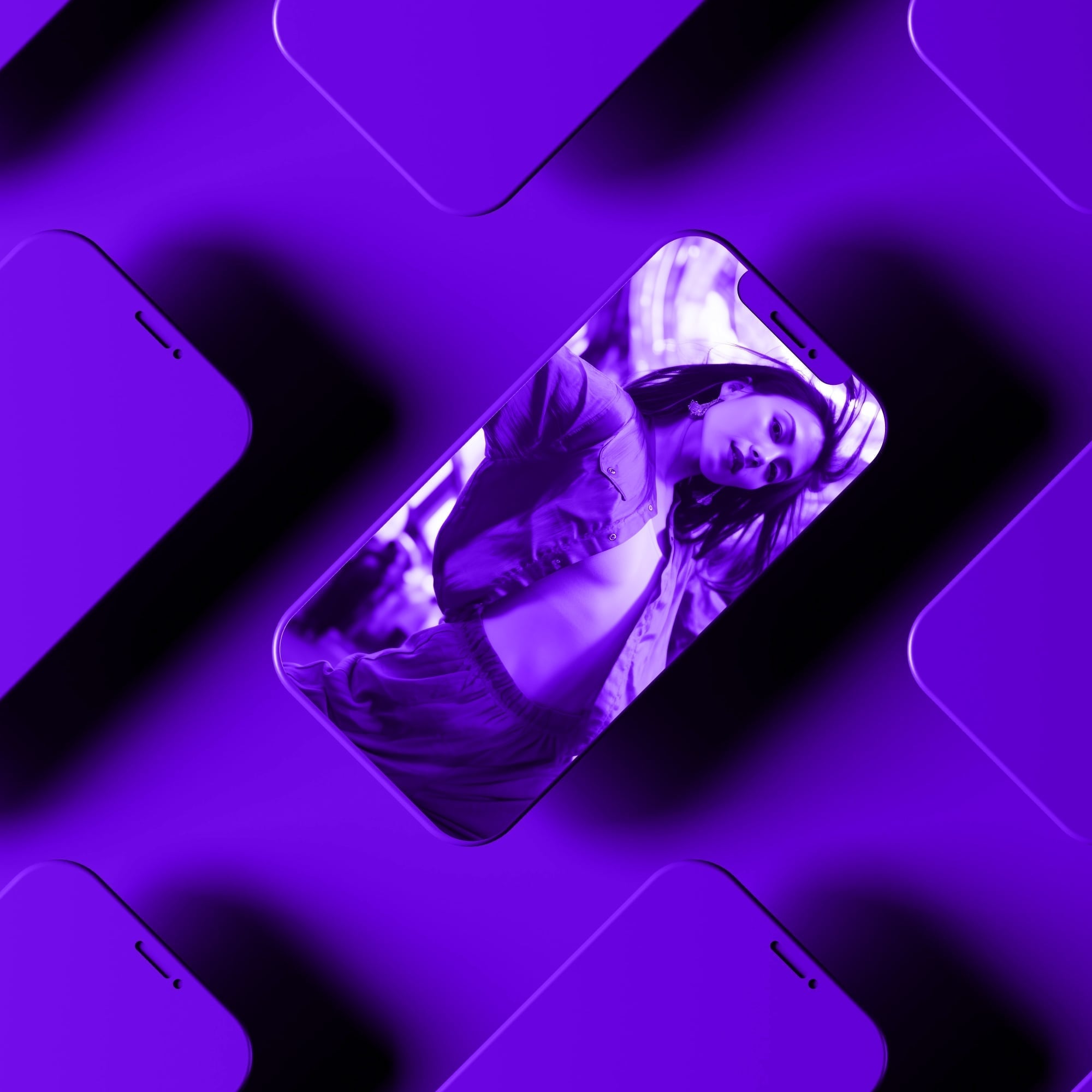 multiple iphones in repeating pattern showing woman portrait purple background