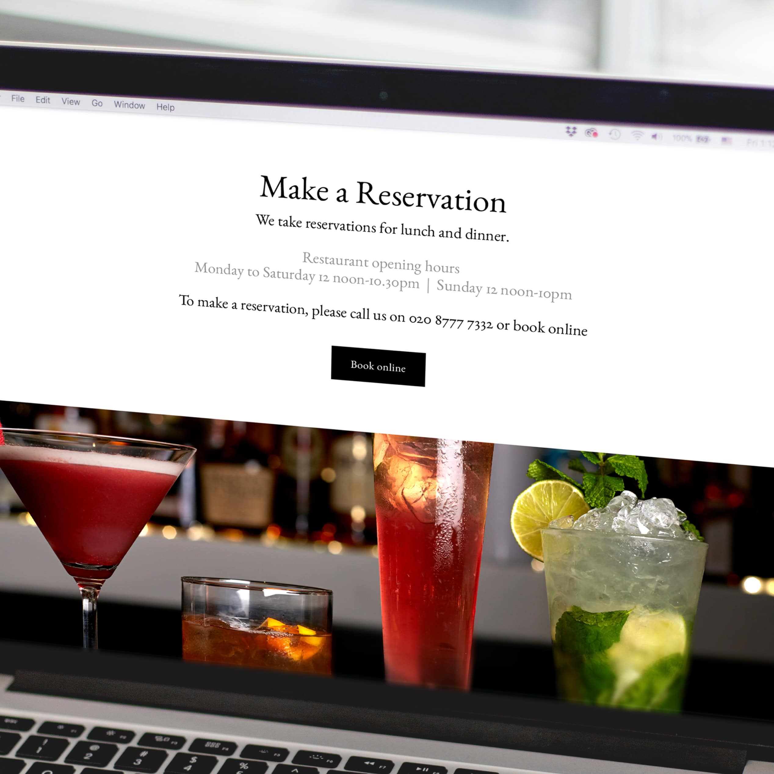 Laptop screen showing Judges “Make a Reservation” page above cocktail photography