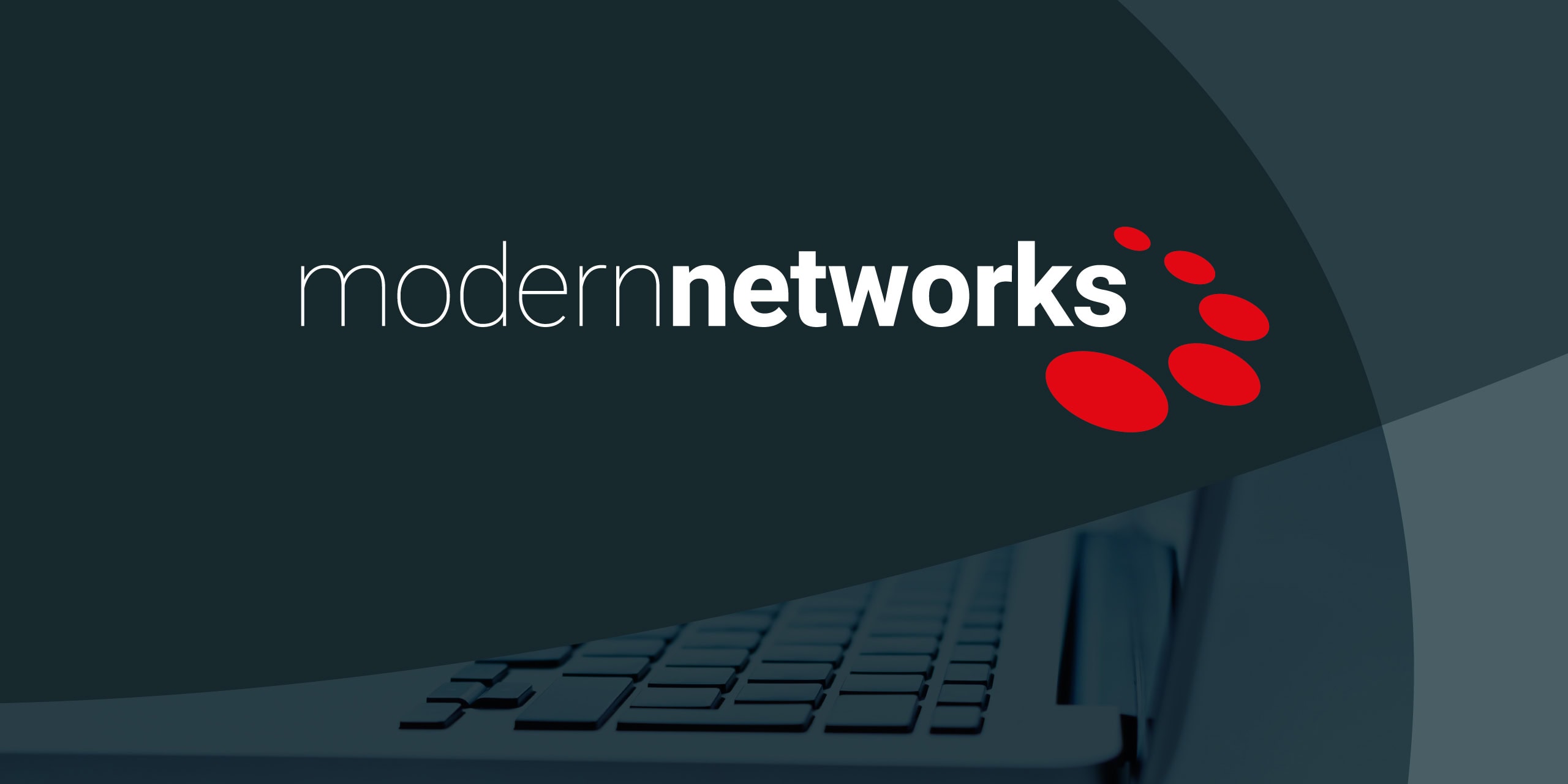 Modern Networks wordmark with red icon over a laptop keyboard background
