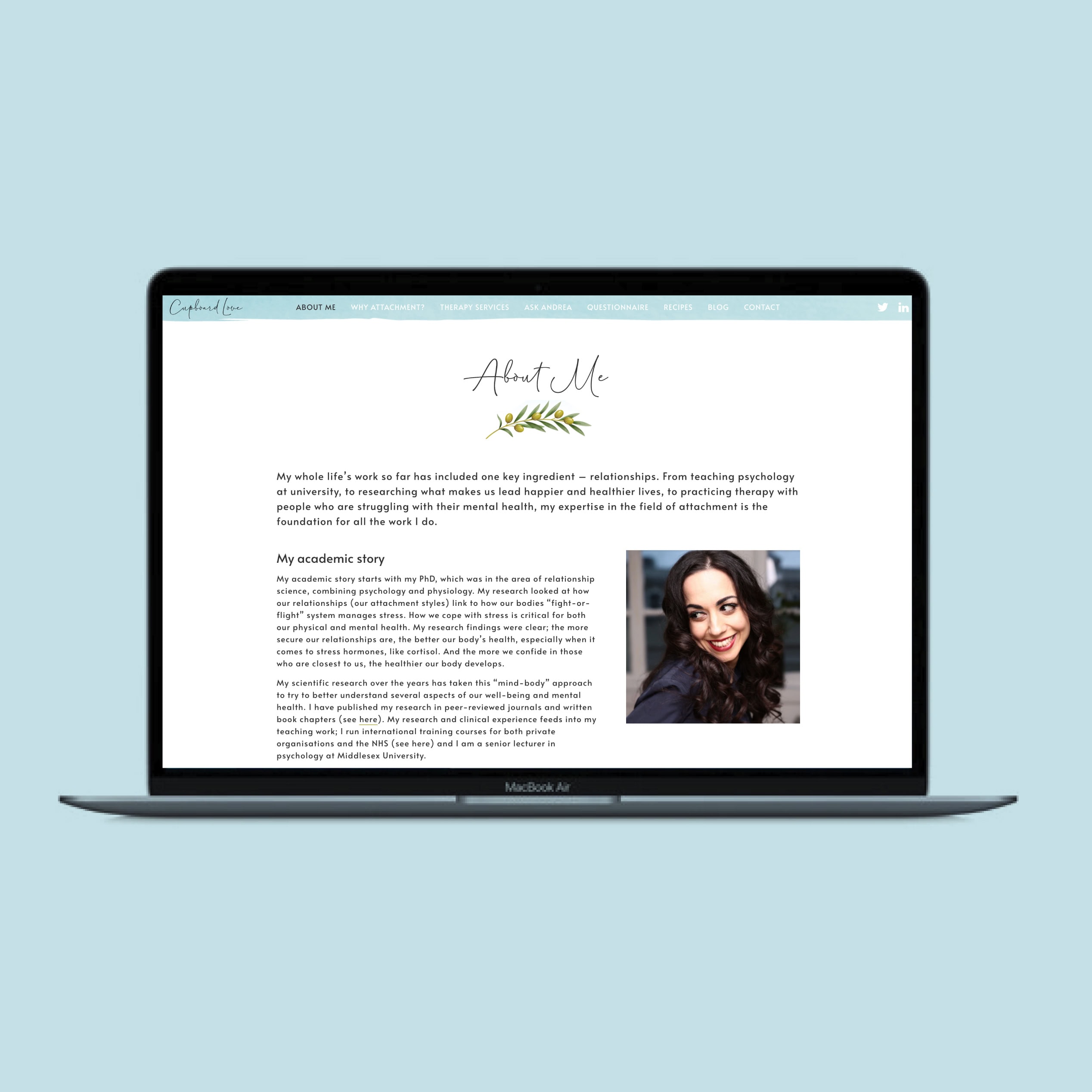 MacBook mockup showing the Cupboard Love “About Me” page with profile photo and page content