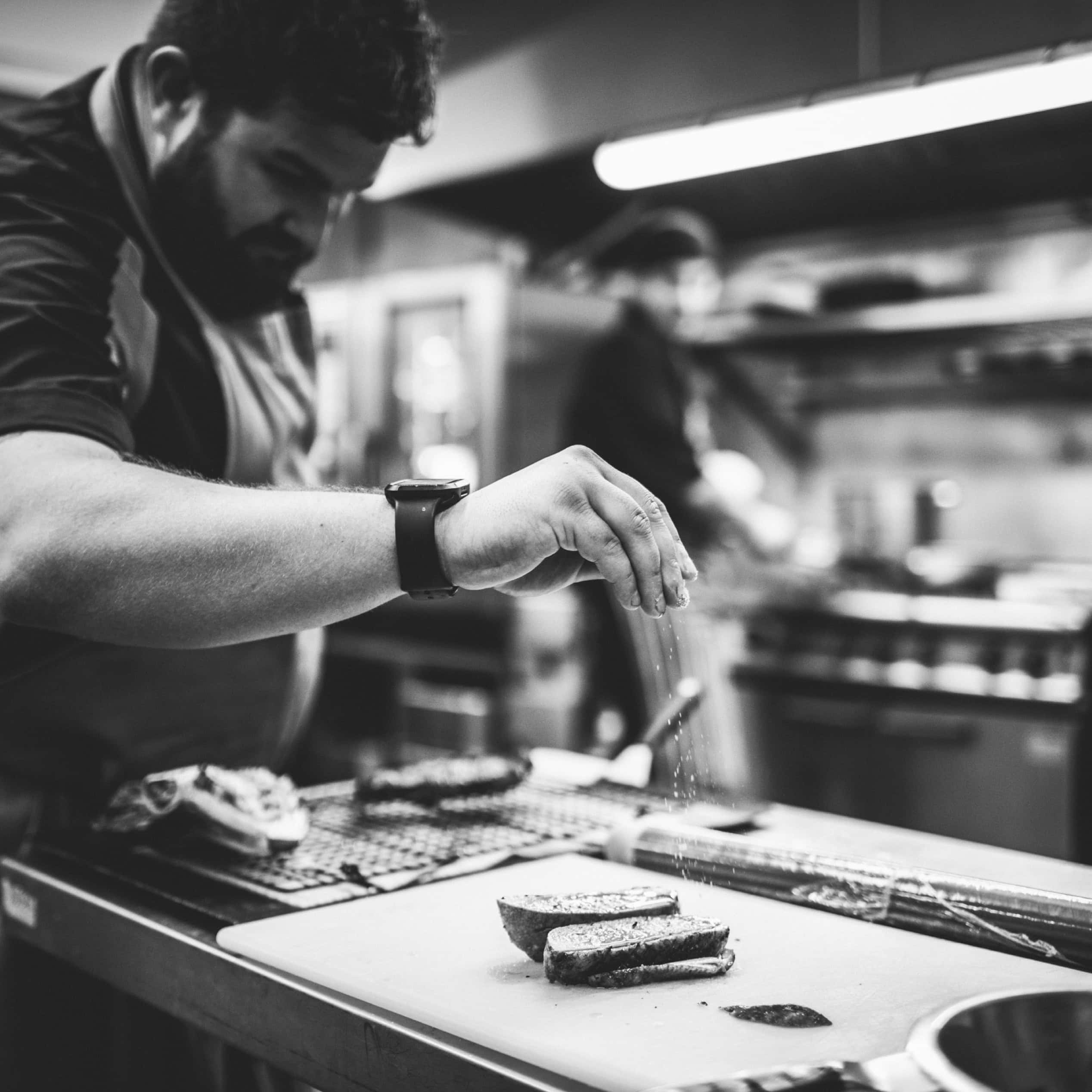 Chef preparing food in the Stratton House kitchen