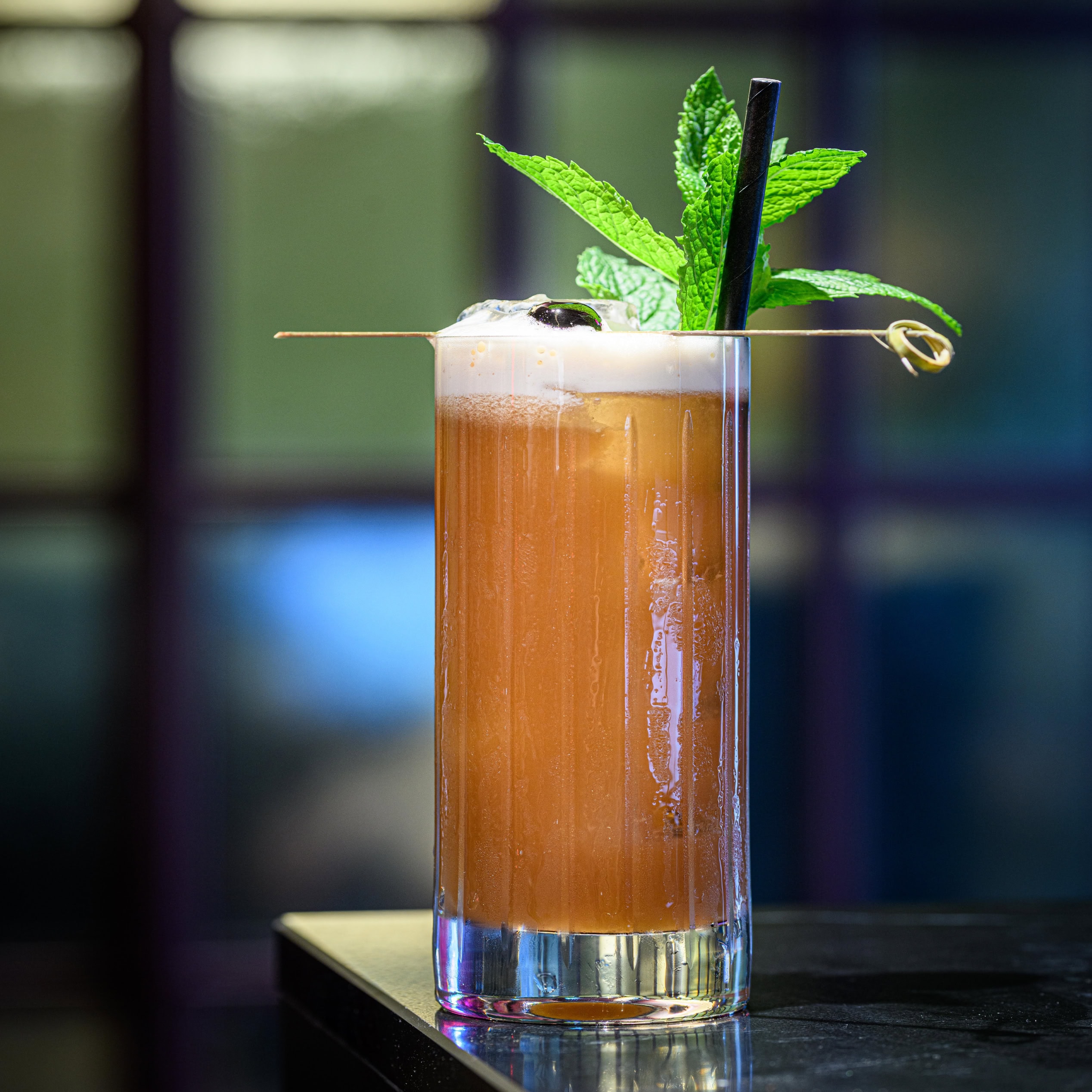 Highball cocktail with mint garnish