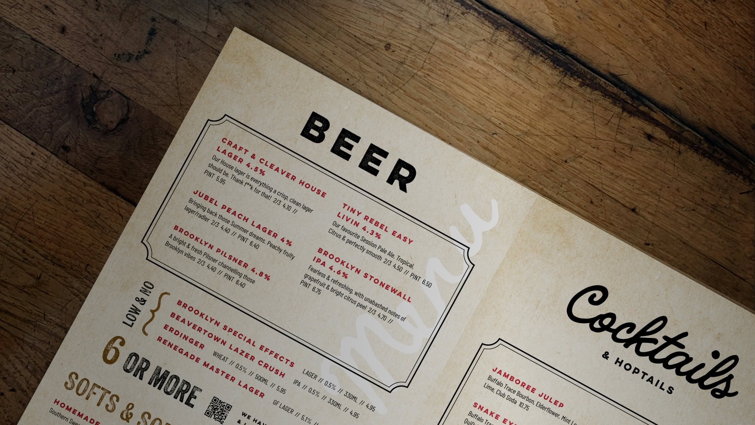 Craft & Cleaver beer and cocktails menu on a rustic wooden tabletop