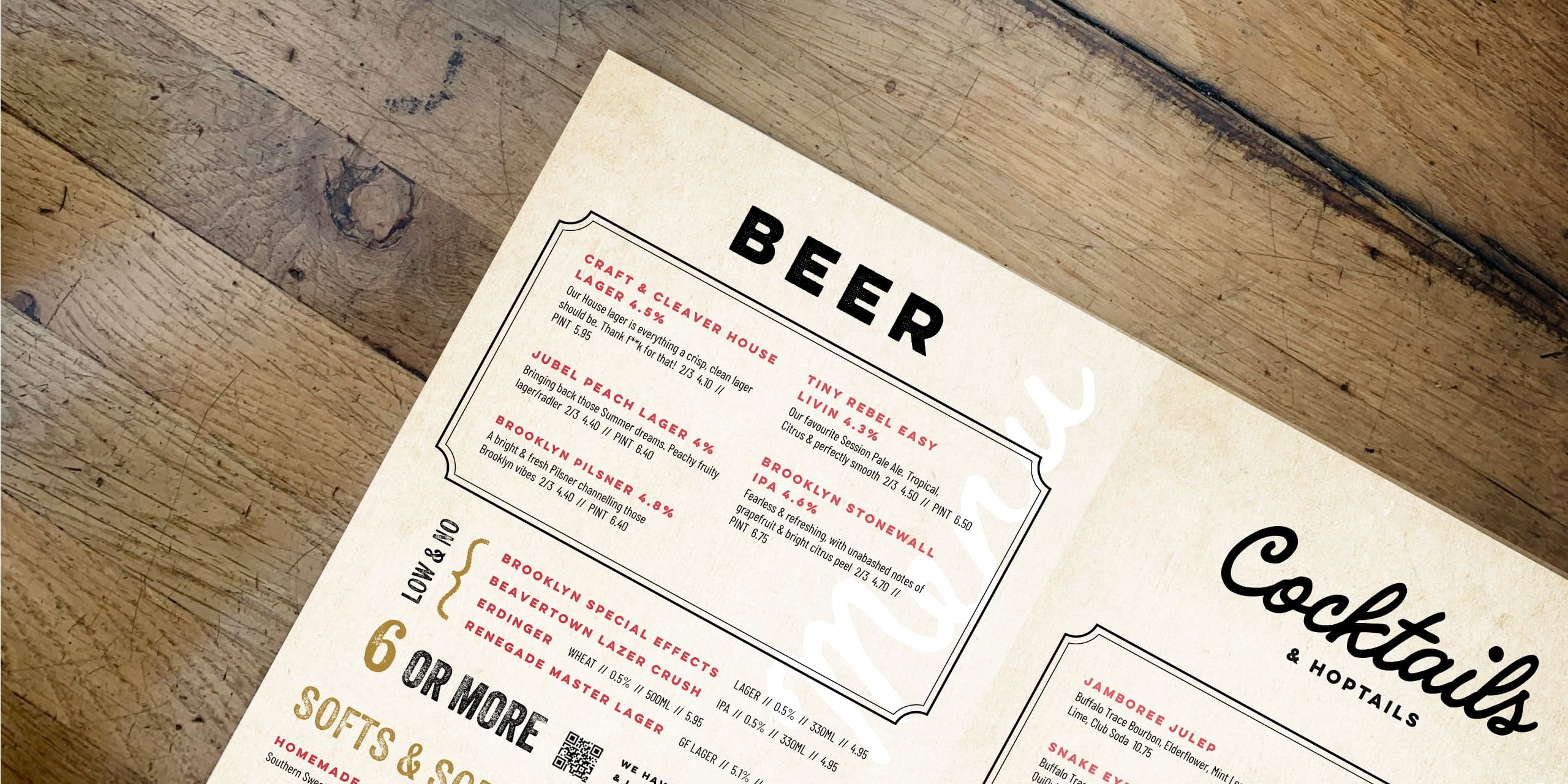 Craft & Cleaver beer and cocktails menu on a rustic wooden tabletop