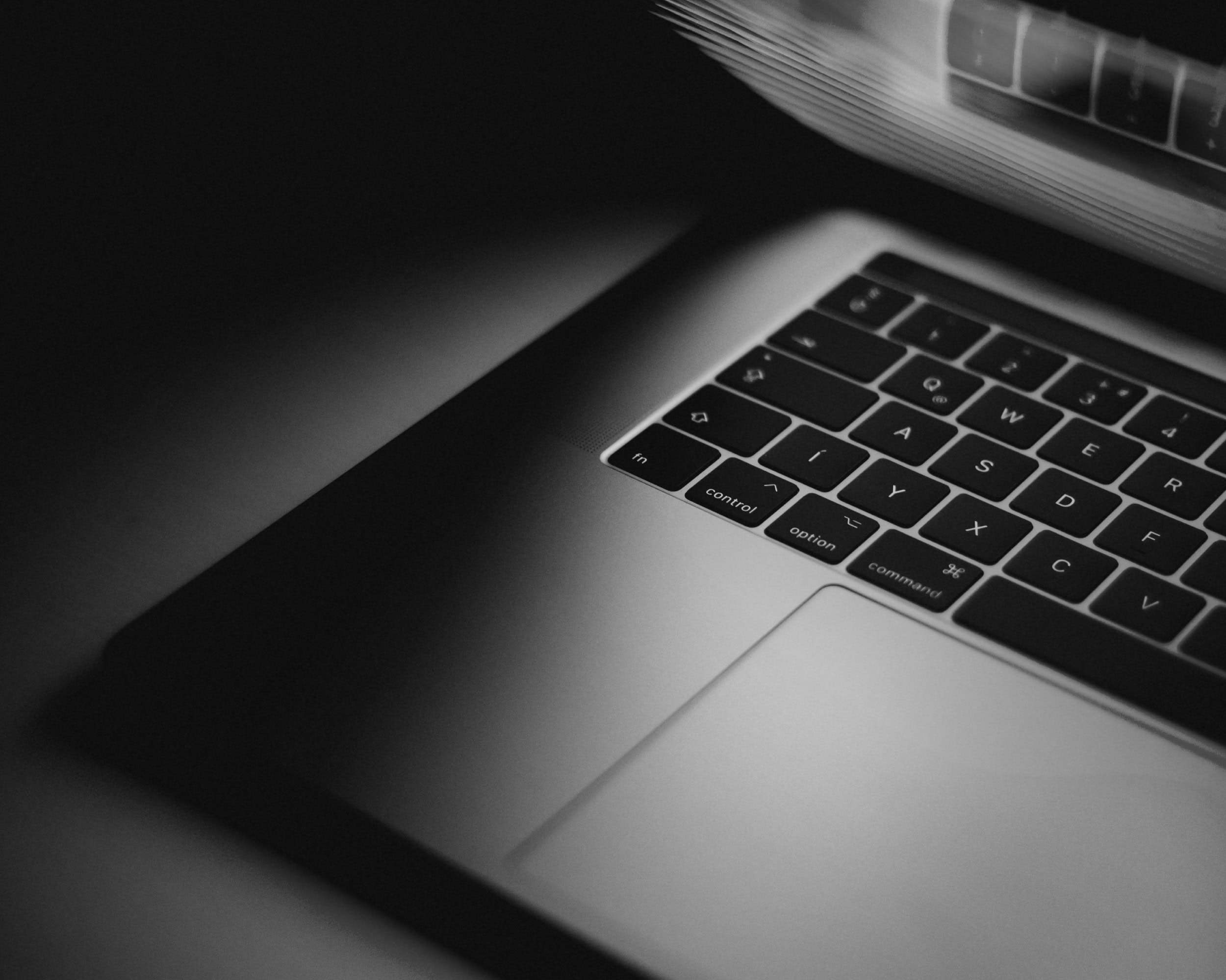 Close-up of partially opened laptop